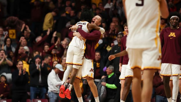 Elijah Hawkins and Kris Keinys embrace